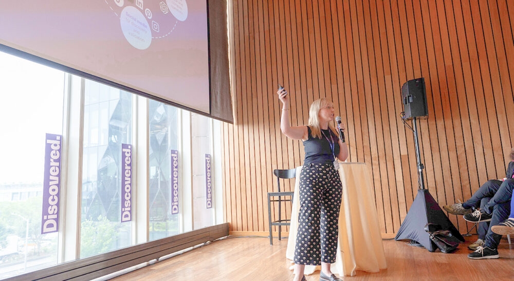 beth-talking-on-stage