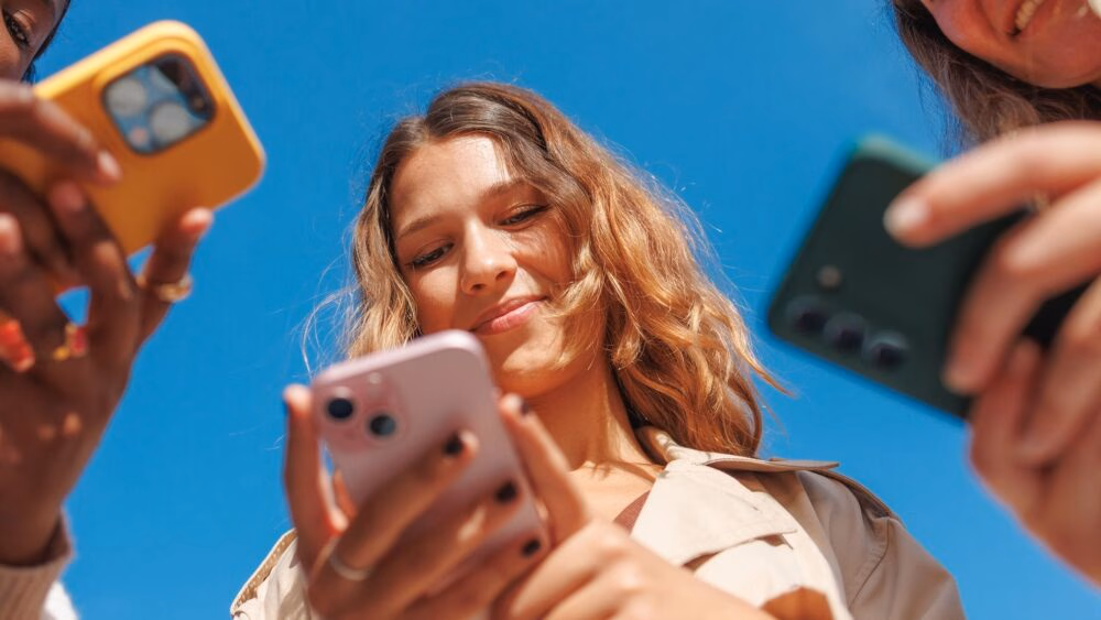 group-of-women-looking-at-phones